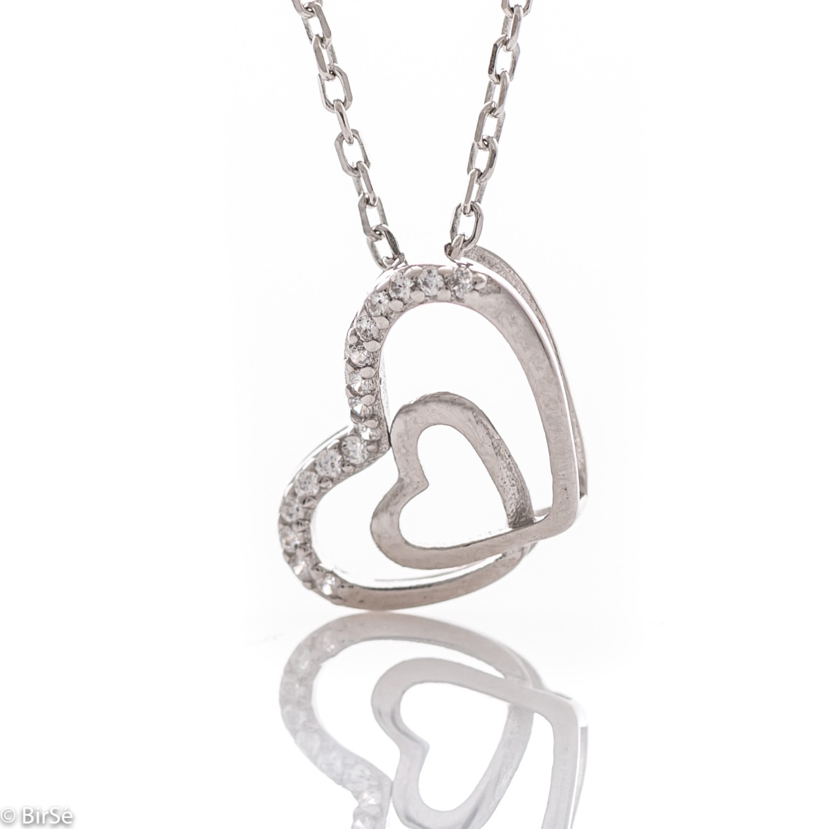 An exquisite women's necklace with two fine intertwined hearts, made entirely of soft rhodium-plated silver, complemented by the sparkle of white zircons.