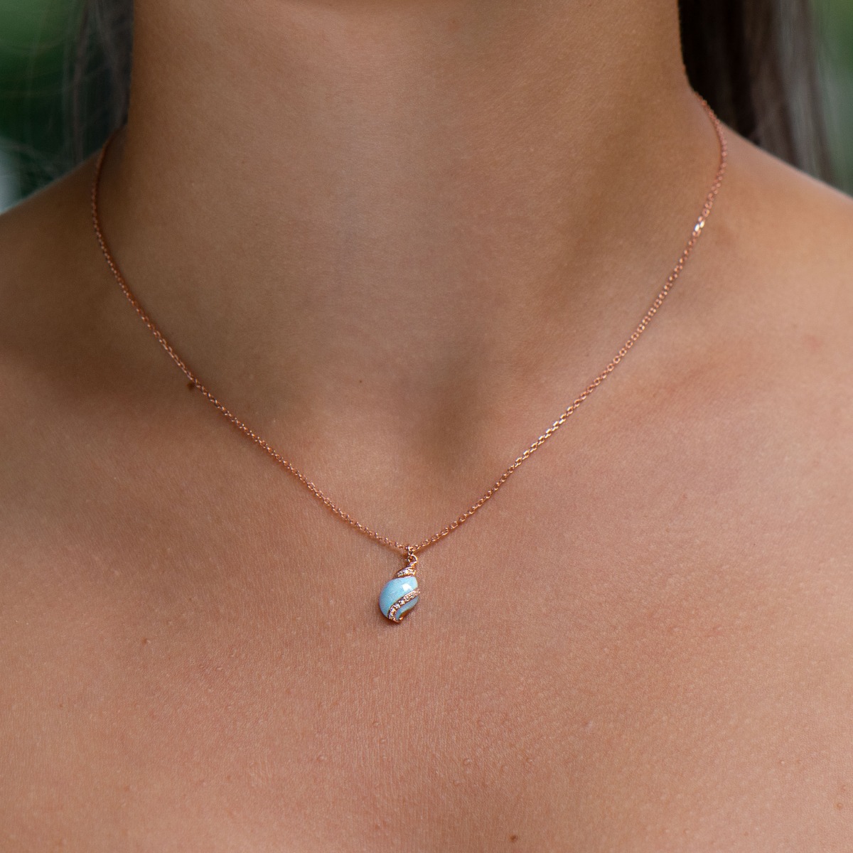 A delicate women's necklace made entirely of lovely rhodium-plated sterling silver with a padlock shape, an elegant heart-like design and a sparkling cubic zirconia for extra opulence.