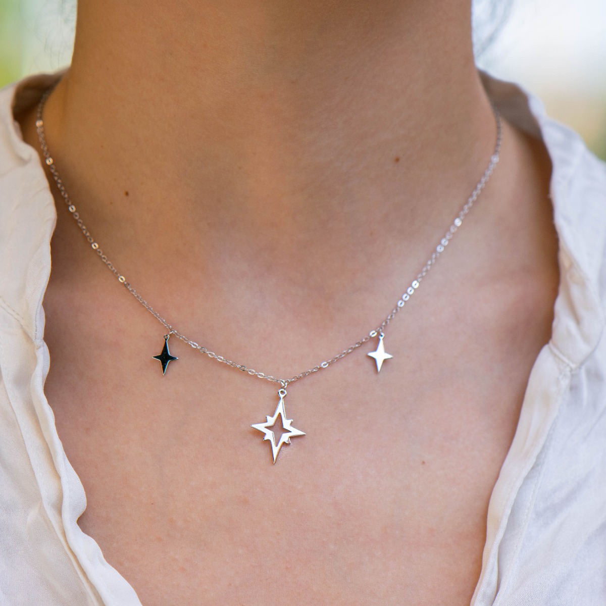 Stone-clear silver women's necklace with exquisitely crafted pendants, in the shape of the Vechernitsa star.