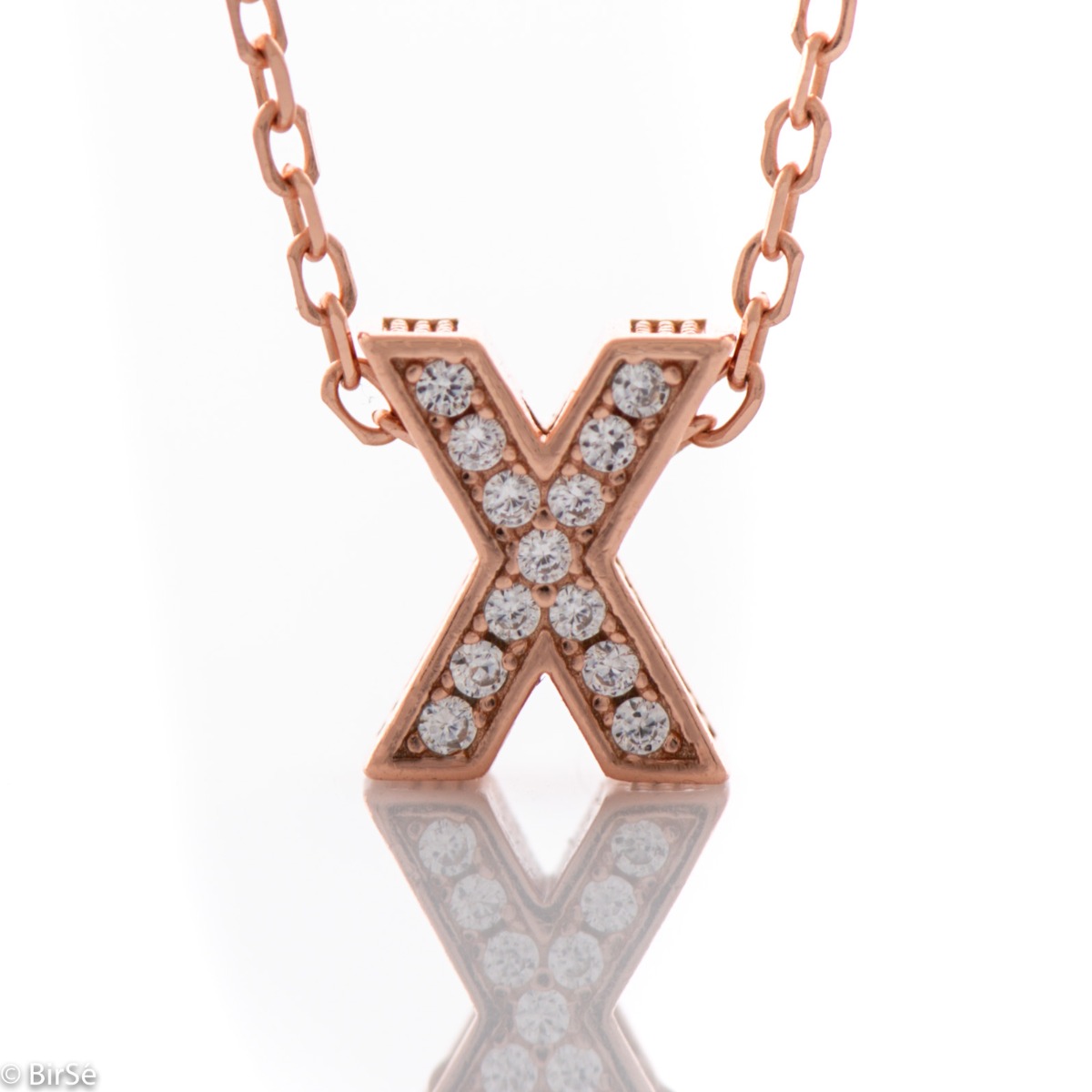 Finely crafted rose silver letter X necklace for women, all encrusted with glittering zircons. An attractive piece of jewelry in which the delicate beauty of rose silver is skilfully combined with the brilliance of zircons.