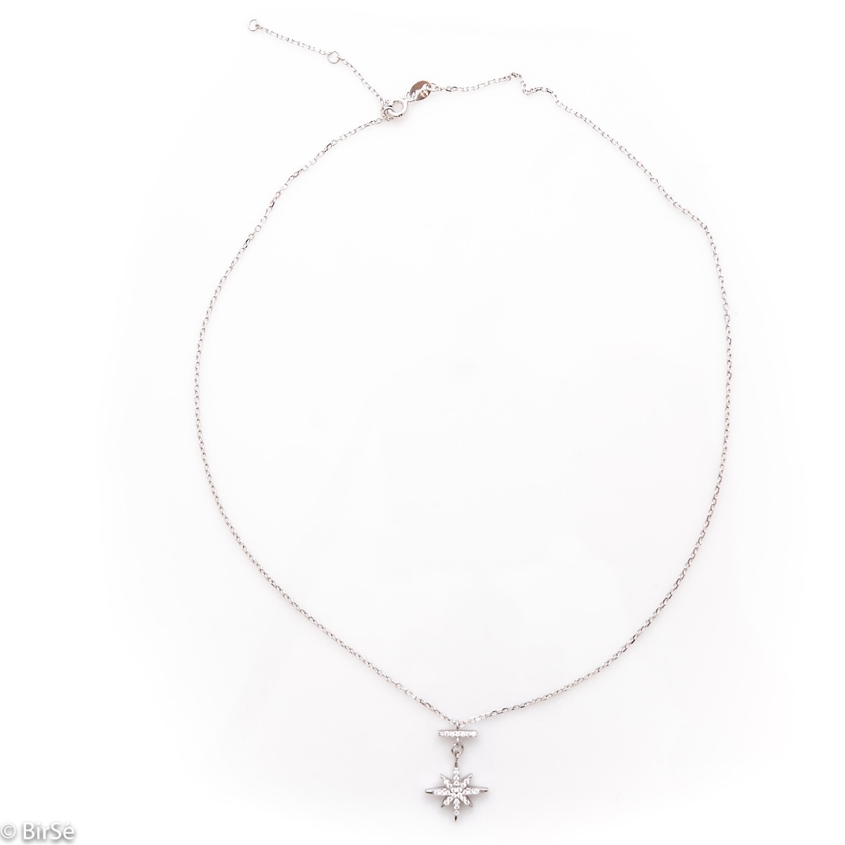 A spectacular silver necklace with an elegant, slightly dangling element of a glittering star studded with fine zircons and made entirely of rhodium-plated silver.