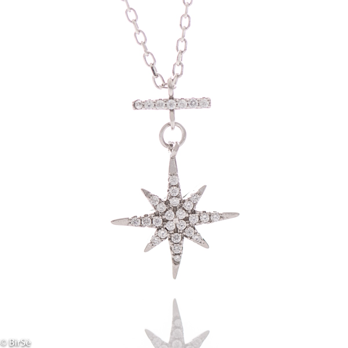 A spectacular silver necklace with an elegant, slightly dangling element of a glittering star studded with fine zircons and made entirely of rhodium-plated silver.