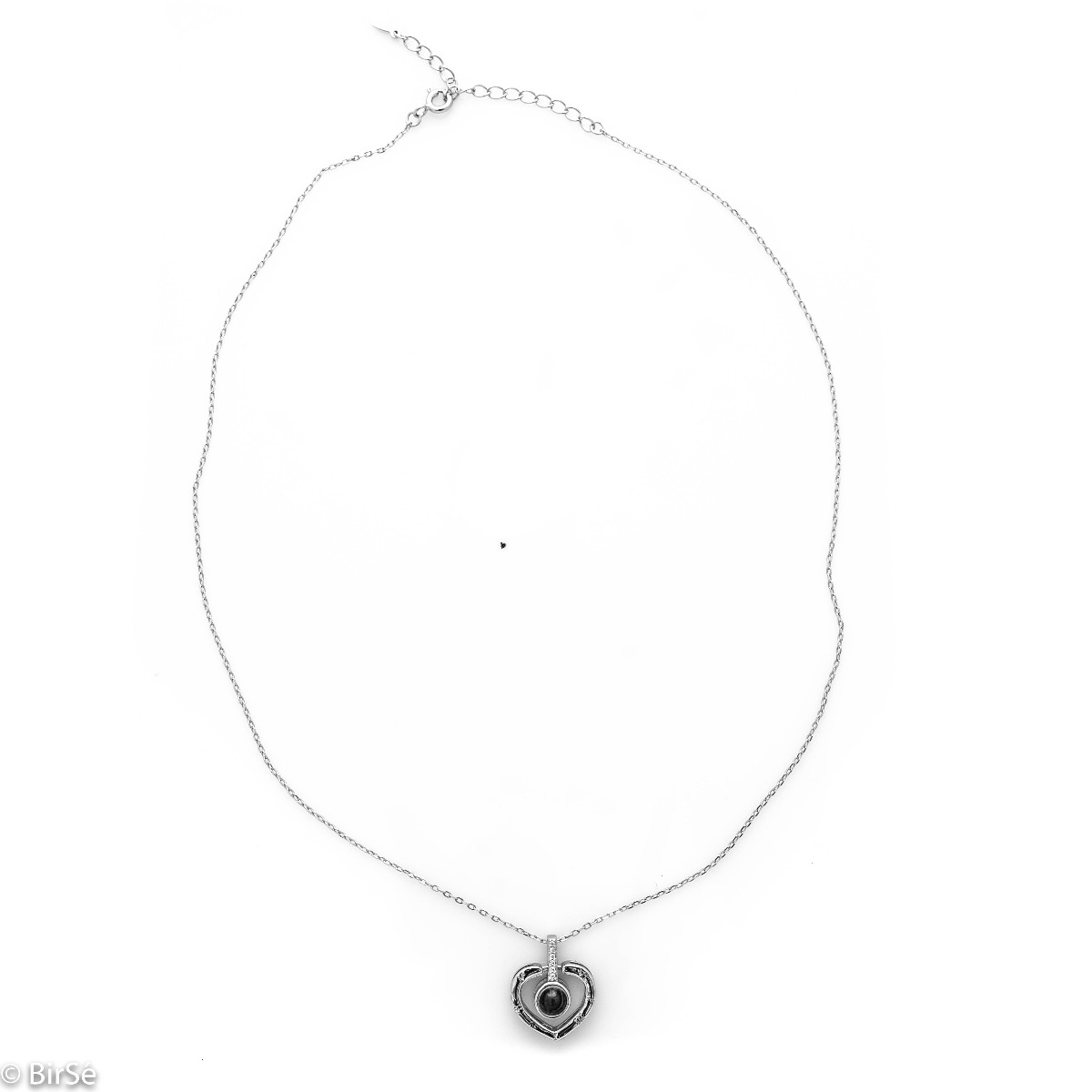 Delightful craftsmanship of rhodium silver heart shaped necklace. A unique stone adorns the center of the heart and upon its illumination, the magic of love will wash over you in 100 languages. There is no better way to say "I love you" x 100.