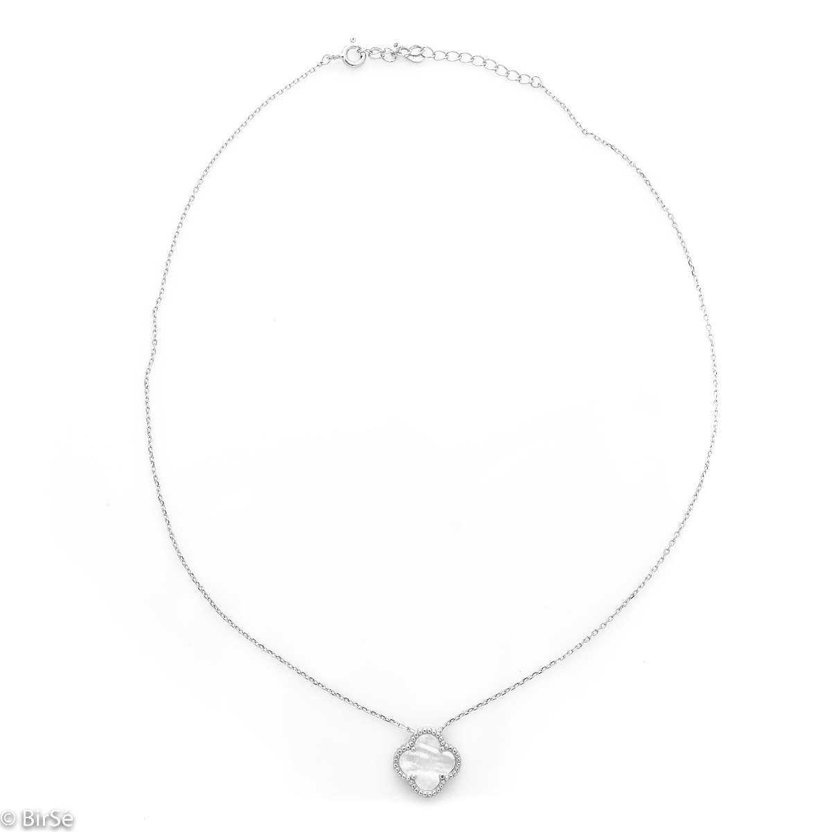 Fine silver Van Cleef model necklace. A beautifully crafted piece of rhodium-plated silver, gently envelops a fine mother-of-pearl in the shape of a four-leaf clover. The chain is delicate, with an extender to be worn according to the lady's preference.