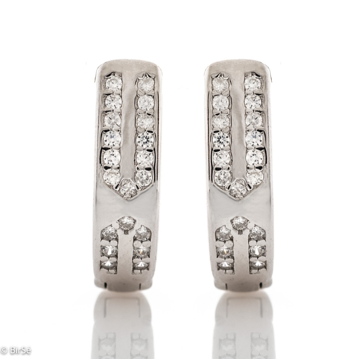 A beautiful model of women's earrings, entirely made of fine rhodium silver, with a comfortable and secure English clasp. Gentle, glittering zircons, located in an exquisite tangle of silver, form the front part of the jewelry. Charming and practical for 