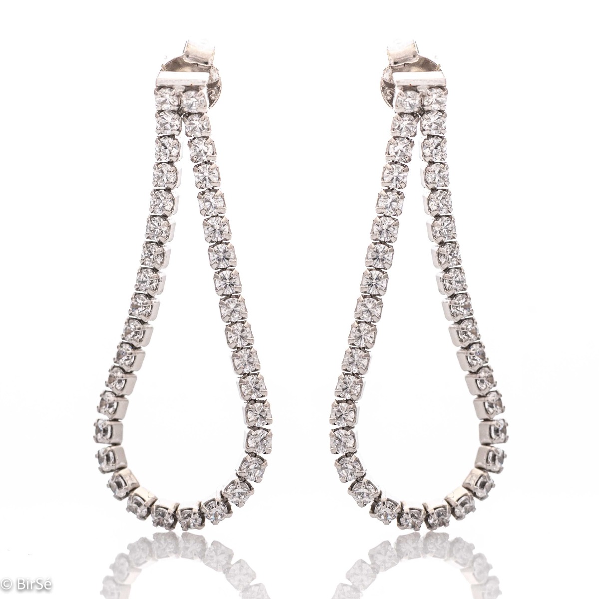 A stylish model of women's dangling earrings, with an elegant design, completely formed by combining rhodium-plated silver with sparkling zircons. The fastening is with a pin - comfortable and practical. A beautiful teardrop shaped piece of jewelery for y