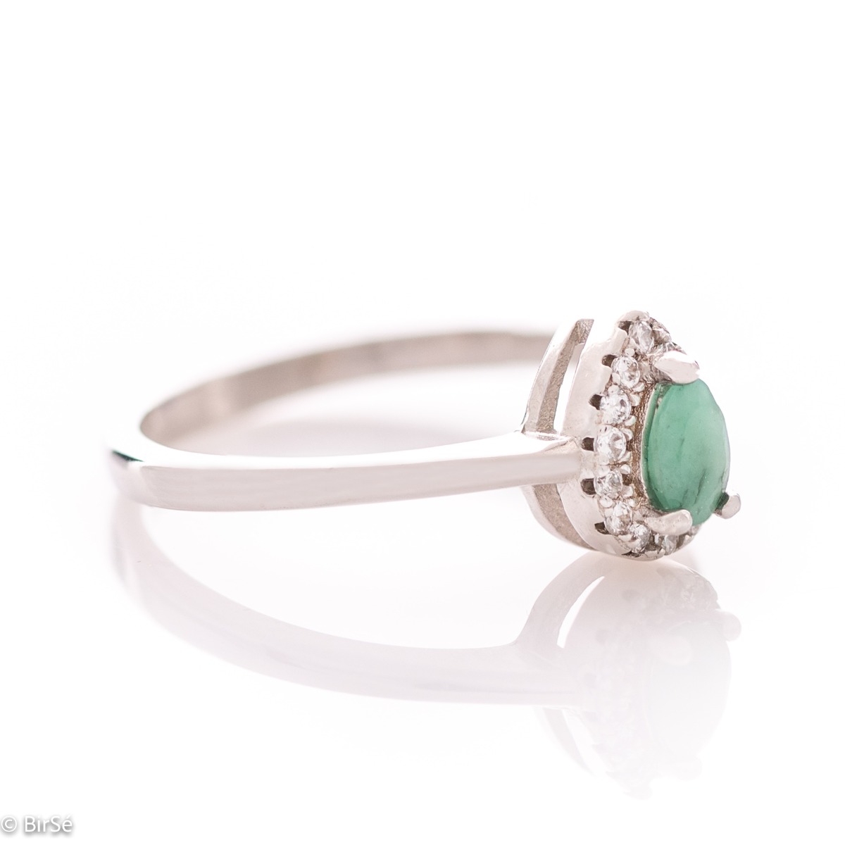 Delicate women's ring with an exquisite natural emerald stone, with a beautiful teardrop shape, surrounded by sparkling zircons and made entirely of rhodium-plated silver.