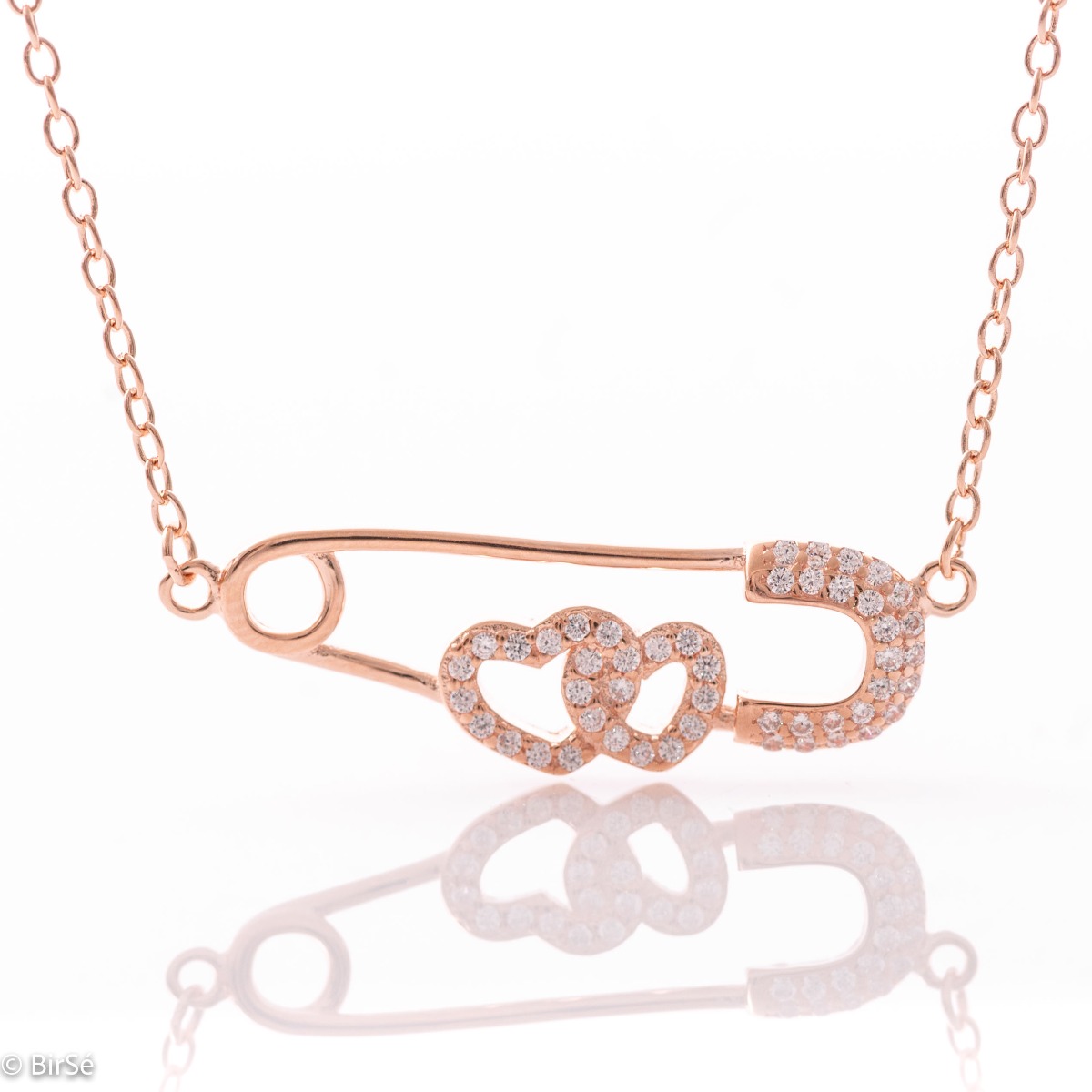 Extravagant women's necklace in soft pink silver in the shape of a safety pin, elegantly holding two hearts in love. For the lady of your heart.