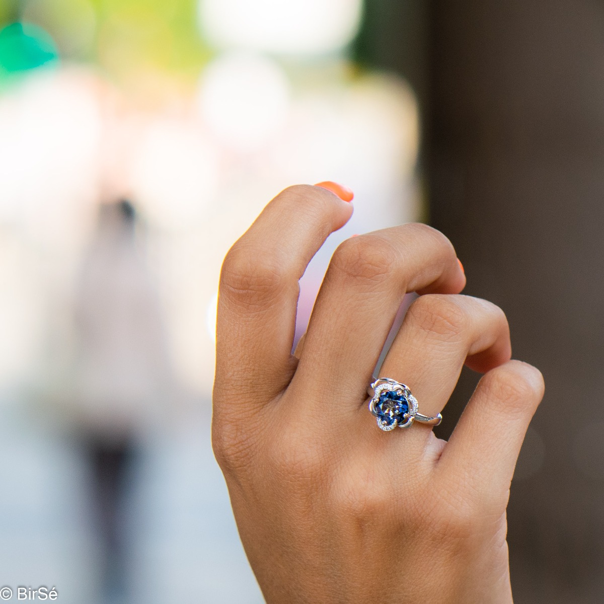 Gentle glow of a natural blue mystic topaz stone complemented by fine sparkling zircons - our new ladies' ring with exquisite details and curves. Part of a charming earring and pendant set.