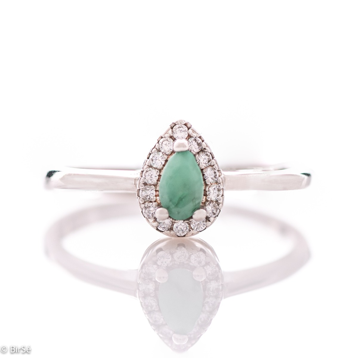 Delicate women's ring with an exquisite natural emerald stone, with a beautiful teardrop shape, surrounded by sparkling zircons and made entirely of rhodium-plated silver.