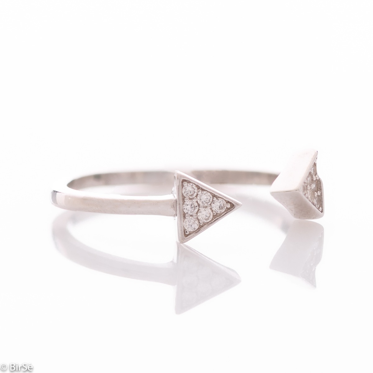 A spectacular open model silver ring, the ends of which are in the form of arrows, elegantly decorated with several zircons. This type of ring allows for one, two number size changes. All jewelry is gift-wrapped and accompanied by a certificate of quality