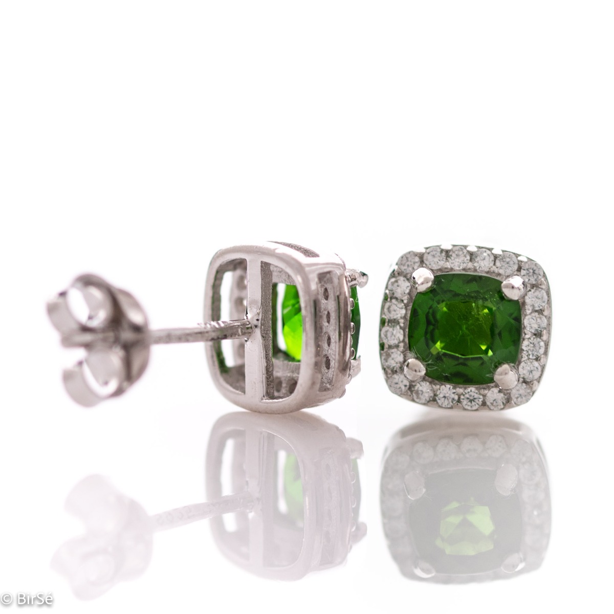 Finely crafted rhodium silver stud earrings with stunning natural chrome diopside in the center surrounded by sparkling cubic zirconias. Can be combined with a ring and pendant from the set.