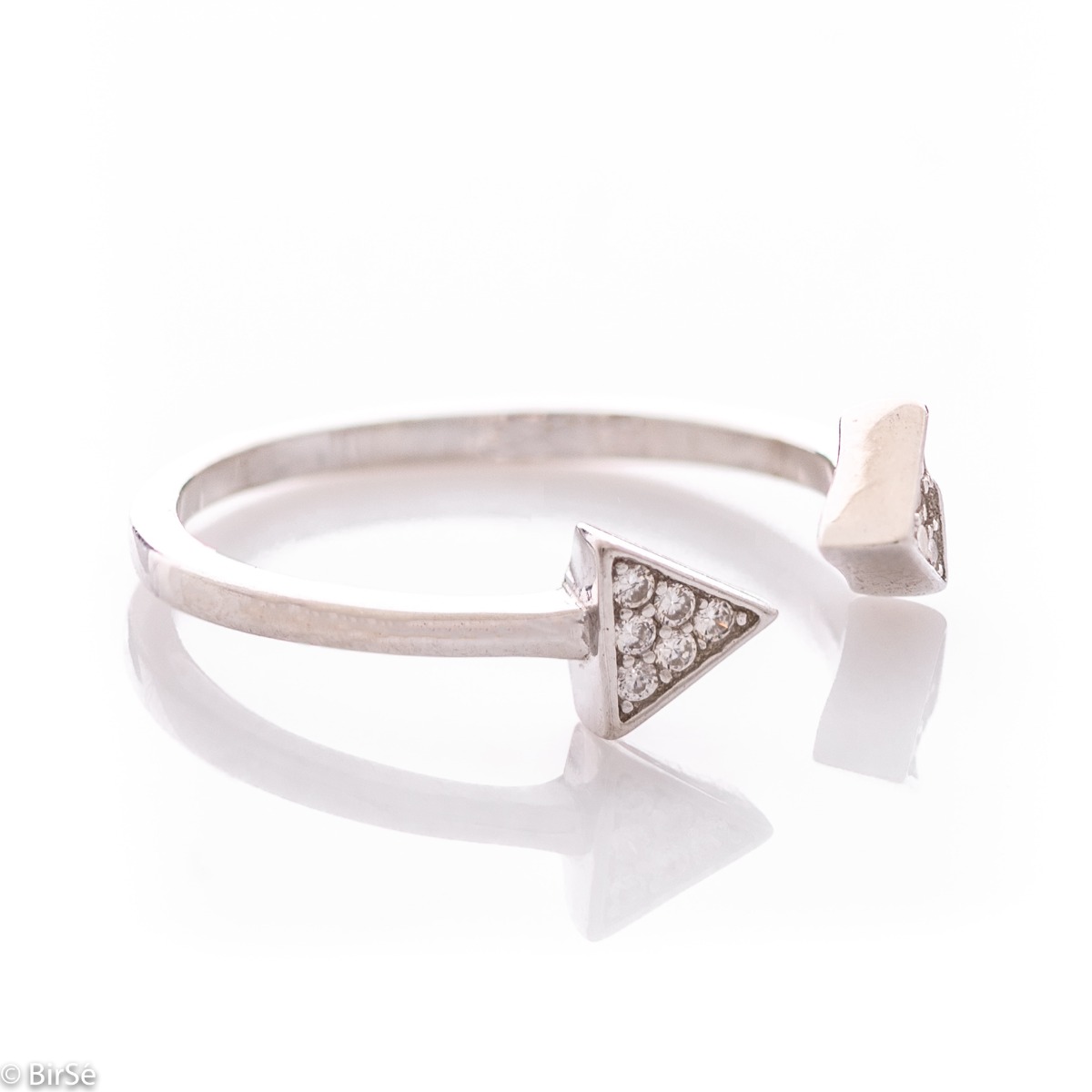 A spectacular open model silver ring, the ends of which are in the form of arrows, elegantly decorated with several zircons. This type of ring allows for one, two number size changes. All jewelry is gift-wrapped and accompanied by a certificate of quality