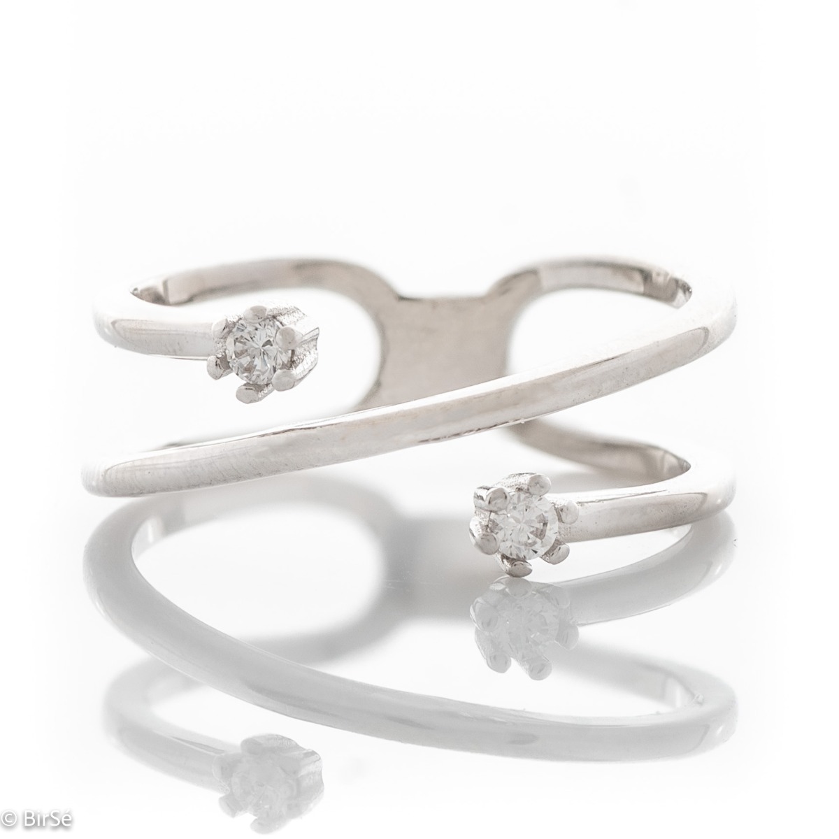 An elegant and captivating women's ring made entirely of shiny rhodium silver with an interesting design and two delicate zircons.