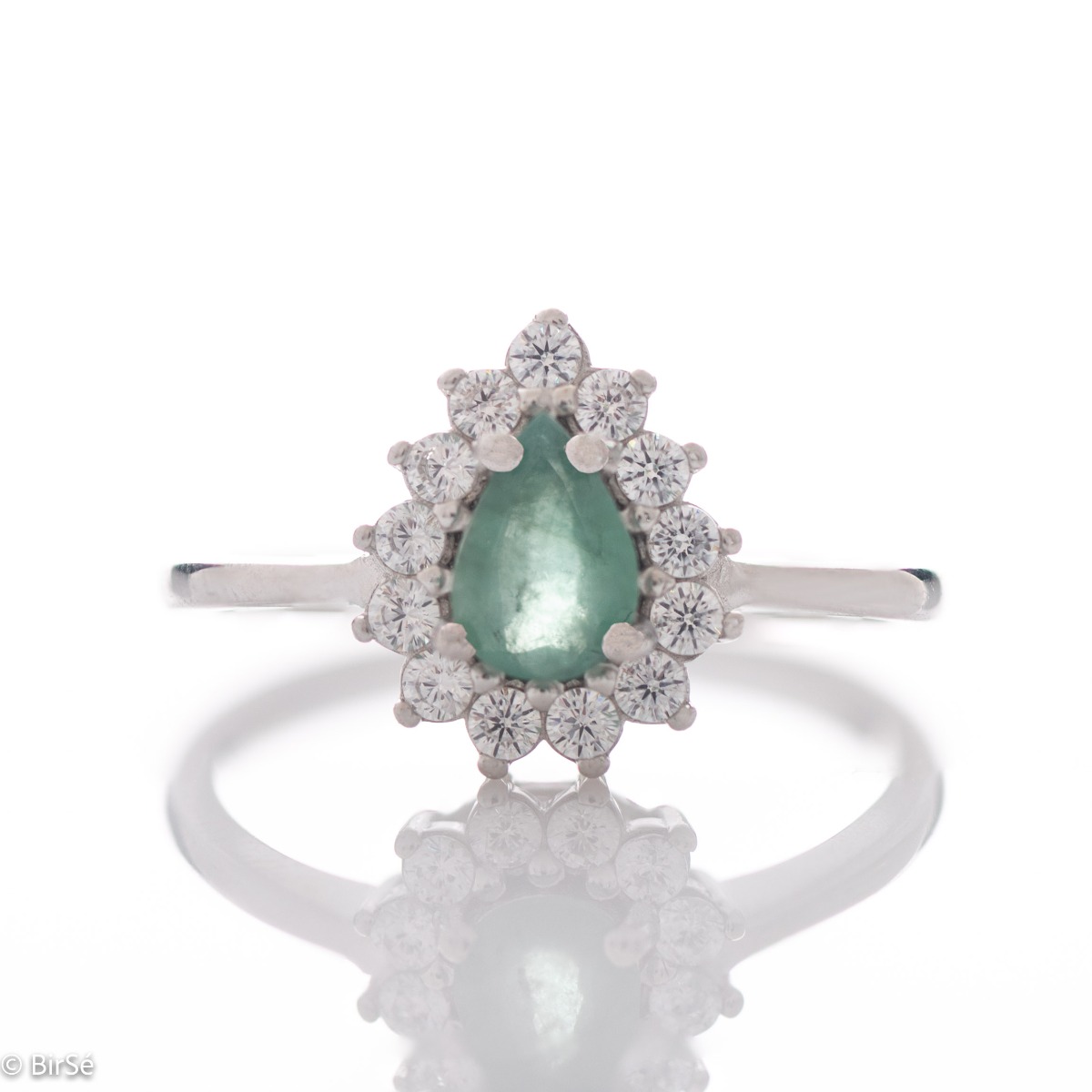 Delicate women's ring with a radiant natural emerald stone, in a beautiful teardrop shape, surrounded by sparkling zircons and made entirely of rhodium-plated silver.