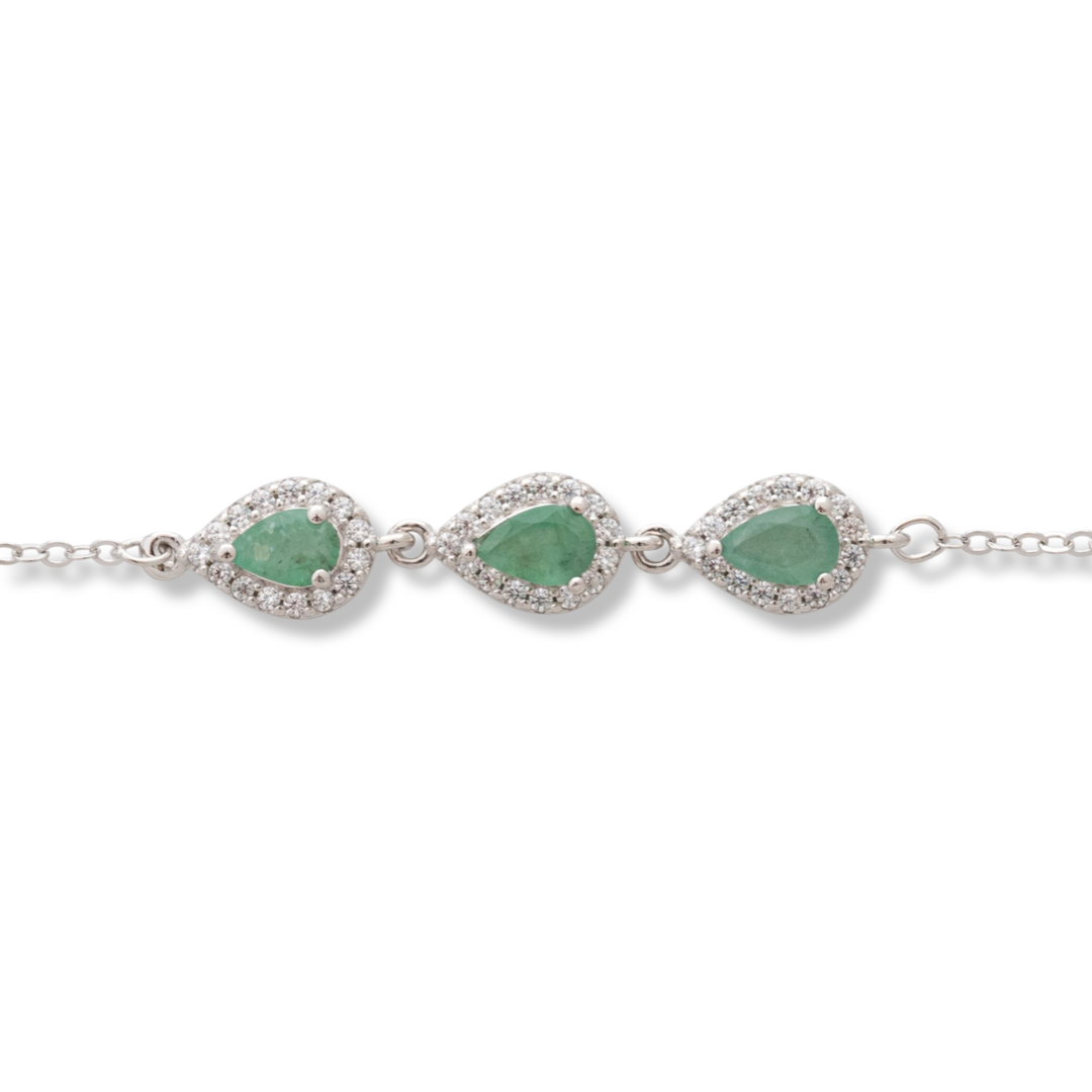 Elegant women's bracelet in soft silver with natural emerald drops, decorated with exquisite and subtle elements and sparkling zircons. The bracelet has an extension, for greater convenience when adjusting the length.