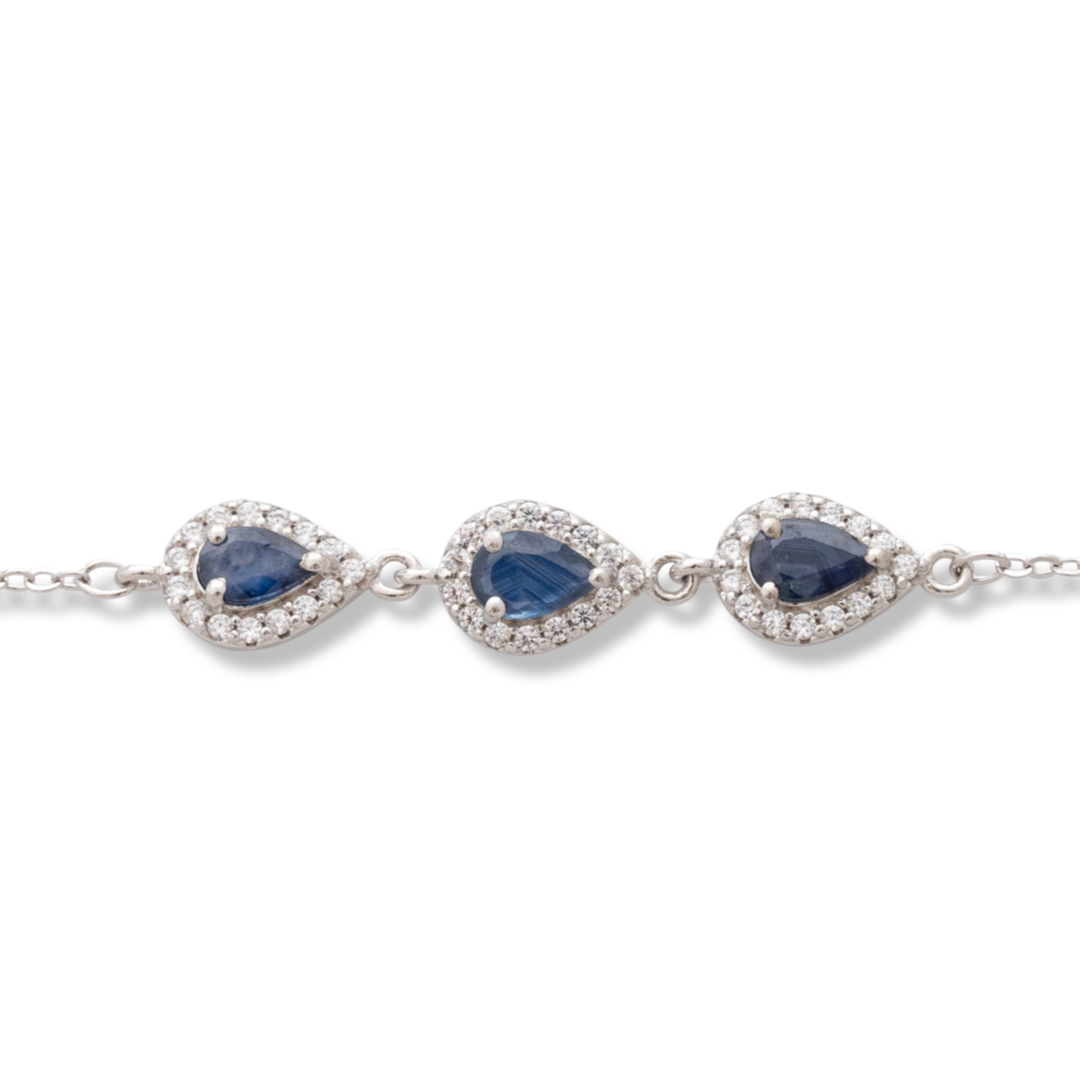 Elegant women's bracelet in soft silver with natural sapphire drops, decorated with exquisite and subtle elements and sparkling zircons. The bracelet has an extension, for greater convenience when adjusting the length.