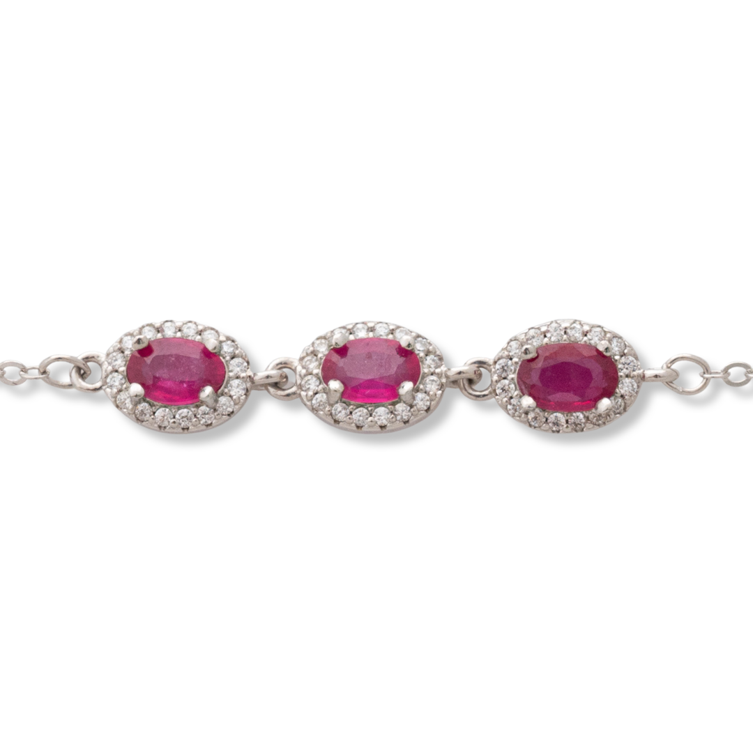 Elegant women's bracelet made of soft silver with natural ruby ​​stones, decorated with exquisite and subtle elements and sparkling zircons. The bracelet has an extension, for greater convenience when adjusting the length.