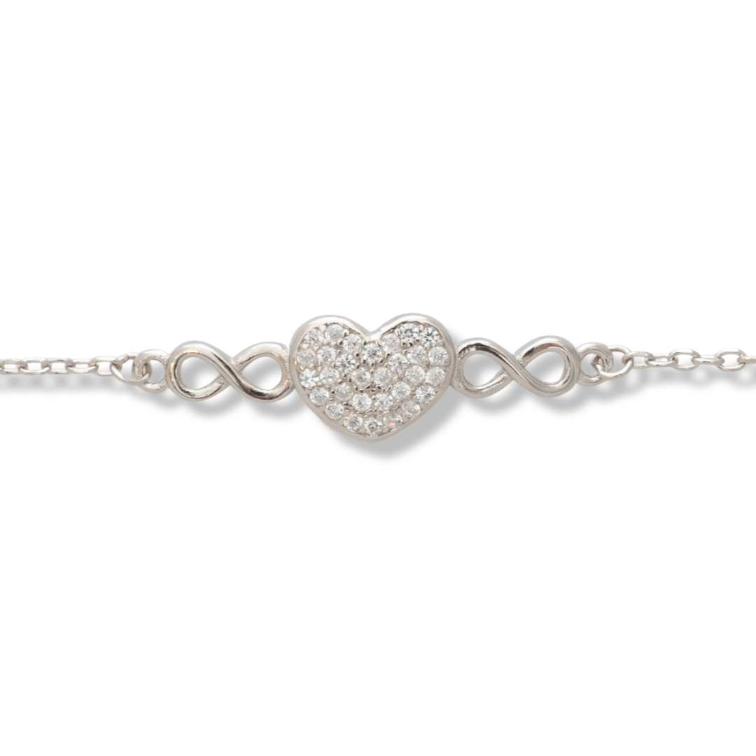 Ethereal women's jewelry in soft silver with an exquisitely crafted heart with sparkling zircons and ethereal infinities. The fine women's bracelet has an extension, for more convenience when adjusting the length.