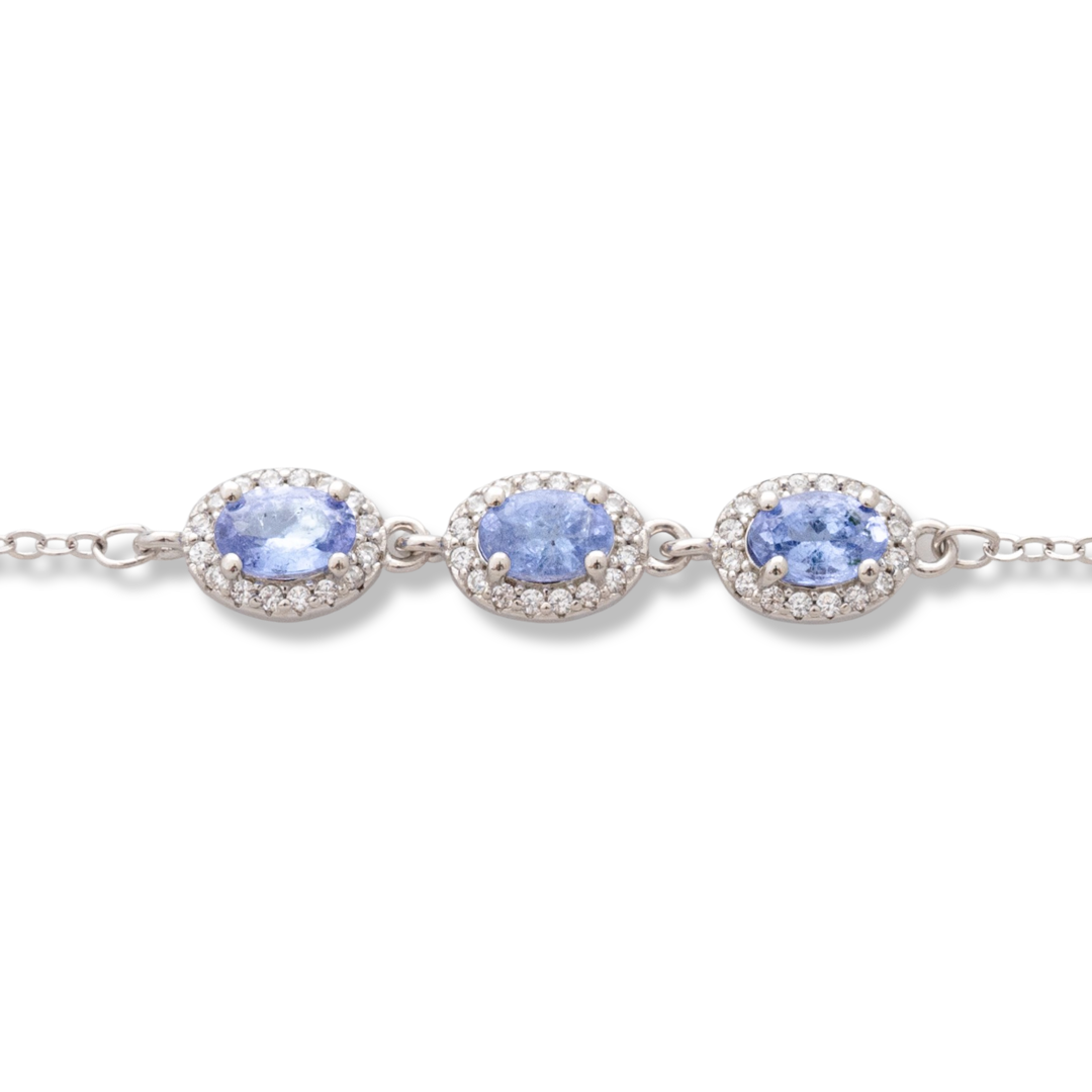 Elegant women's bracelet in soft silver with natural tanzanite stones, decorated with exquisite and subtle elements and sparkling zircons. The bracelet has an extension, for greater convenience when adjusting the length.