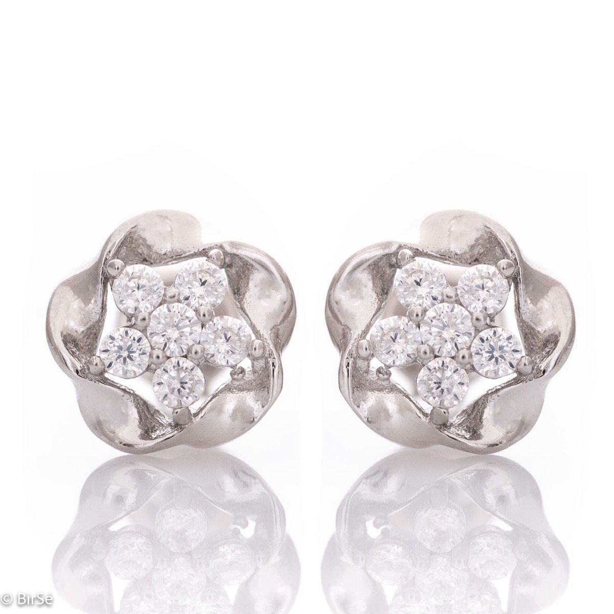 Captivatingly exquisite earrings with a charming design in rhodium silver, elegantly decorated with zircons. Pin fastening for convenience and security. They are beautifully combined with jewelry made of silver and zircons.