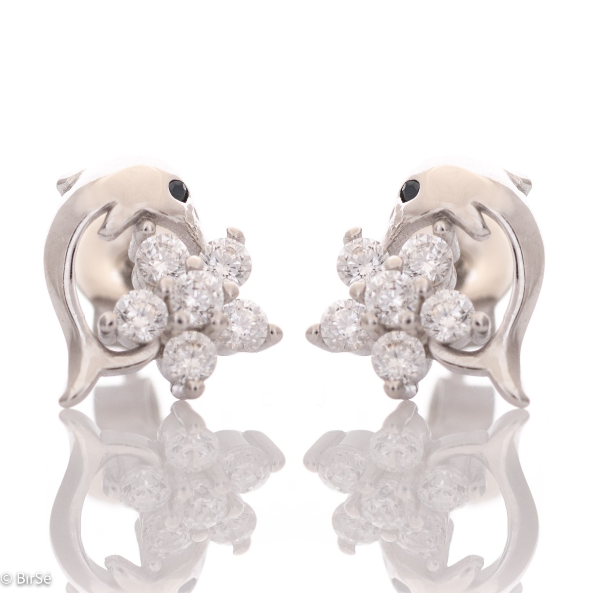 Delicate women's earrings in fine rhodium silver, with an interesting design layout of a charming dolphin, embracing a flower of sparkling zircons.