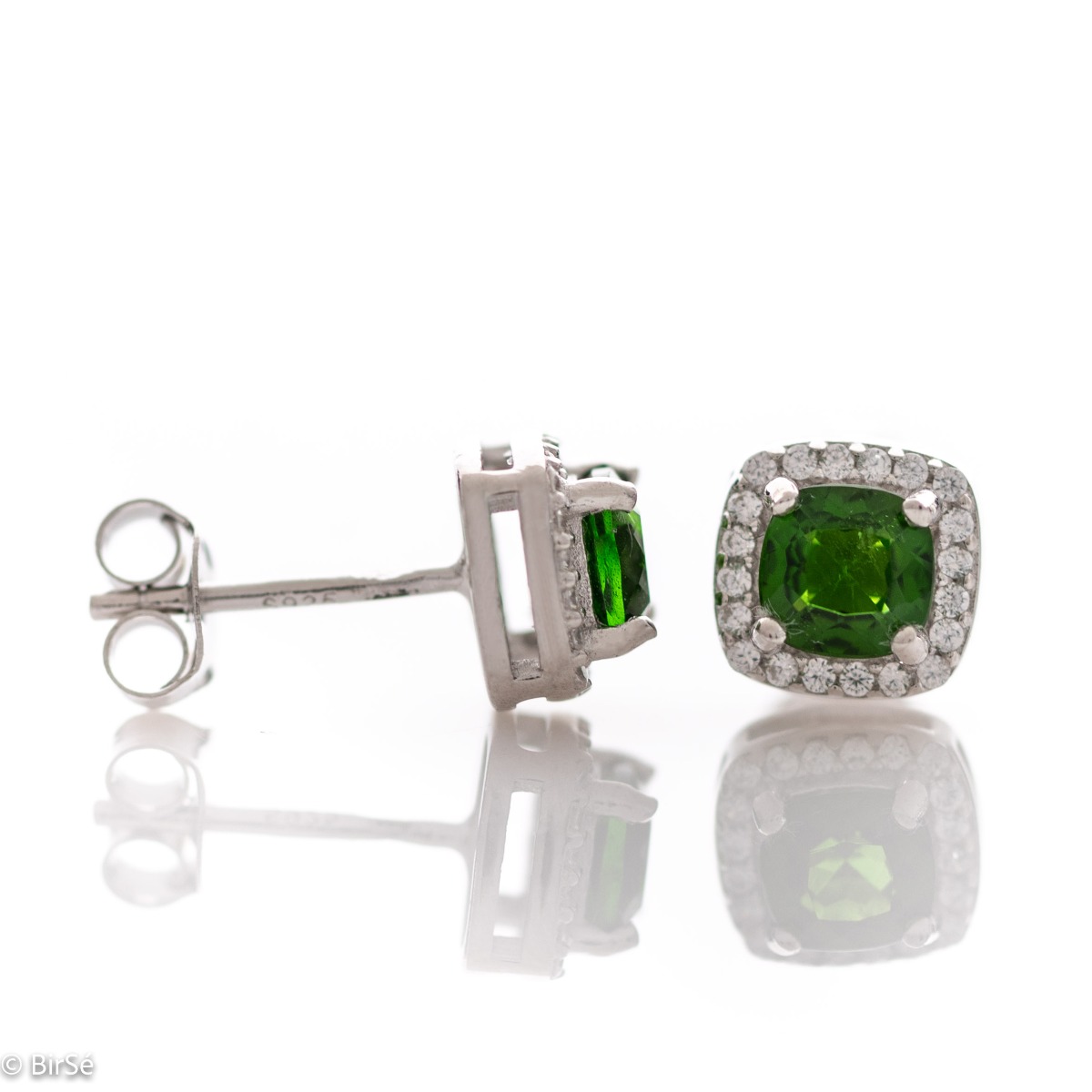 Finely crafted rhodium silver stud earrings with stunning natural chrome diopside in the center surrounded by sparkling cubic zirconias. Can be combined with a ring and pendant from the set.