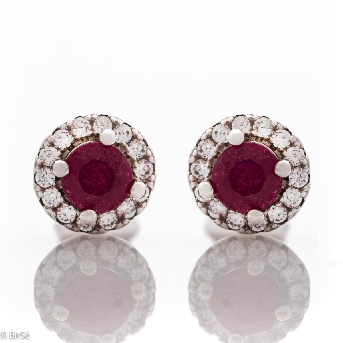 Royal beauty in stunning sterling silver earrings with delicate look and pin fastening. An elegant composition made of a fine combination of rhodium-plated silver with an exquisite ruby ​​and dazzling zircons.