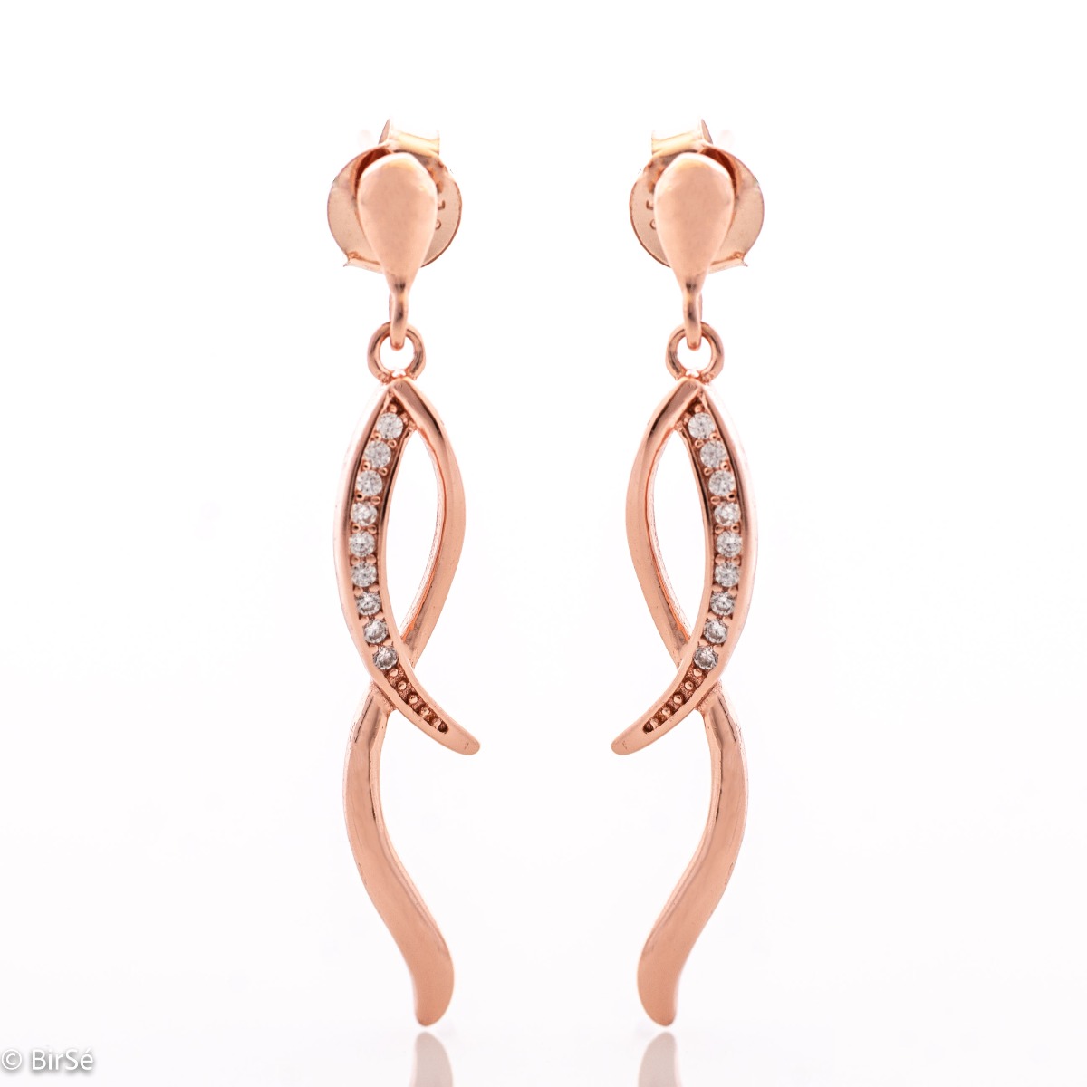 Charming women's dangle earrings made entirely of soft rose silver with exquisitely shaped curves, embellished with dazzling cubic zirconias. Fastening with a pin is for more convenience and comfort.