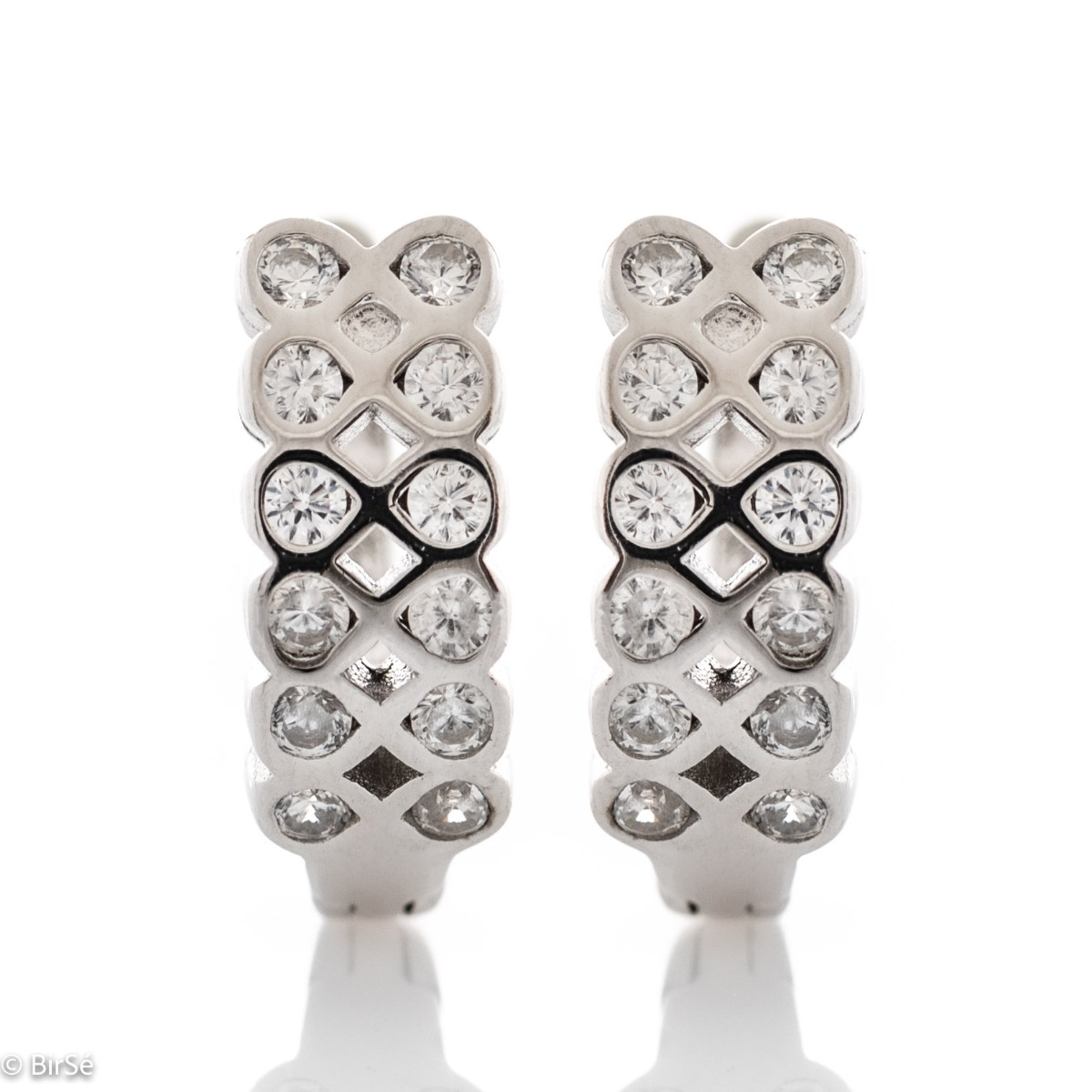 A beautiful model of women's earrings, entirely made of fine rhodium silver, with a comfortable and secure English clasp. Gentle, glittering zircons, located in an exquisite tangle of silver, form the front part of the jewelry. Charming and practical for 