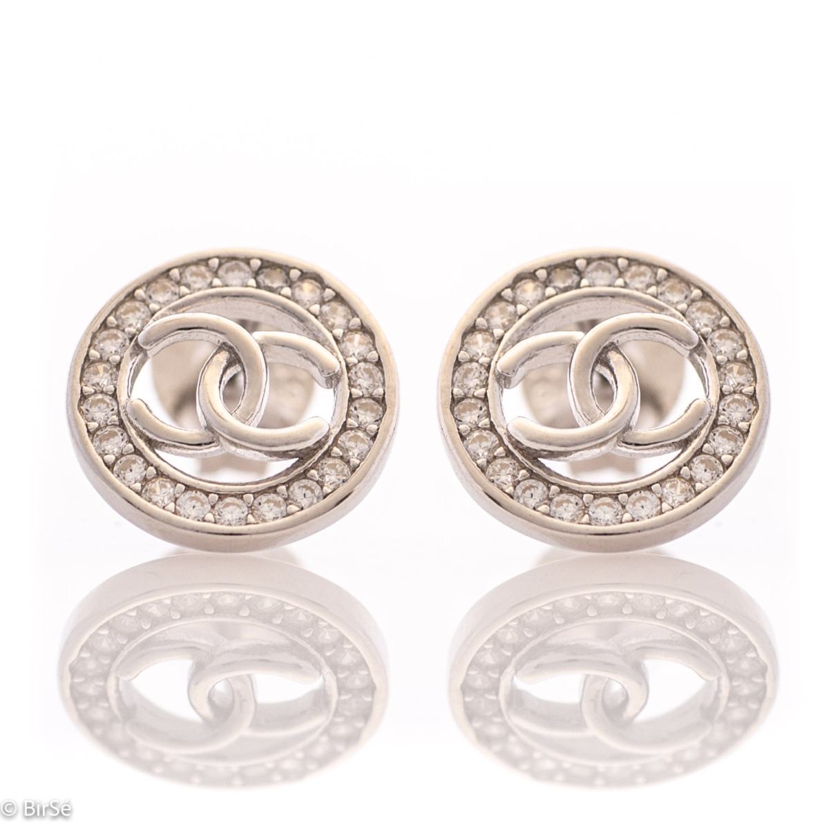 Charming women's stud earrings with a round shape and a stylish design, encrusted with sparkling fine cubic zirconias and made entirely of rhodium silver. Earrings are a suitable gift for any occasion for the beloved woman.