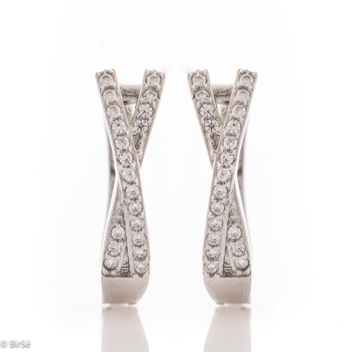 Elegant women's earrings with a spectacular design. Made entirely of rhodium-plated silver, with a comfortable English clasp and an extravaganza of sparkling zircons.