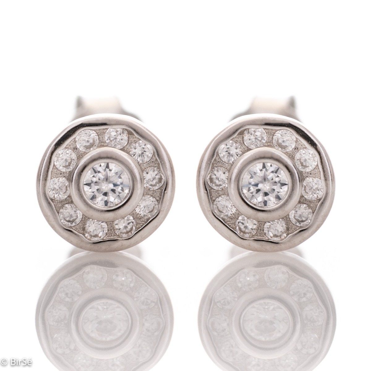 Charming women's earrings, masterfully crafted from fine rhodium silver with an elegant design. The elements are beautifully sculpted, dazzling zircons magically sparkle, and the pin fastening is comfortable and practical.