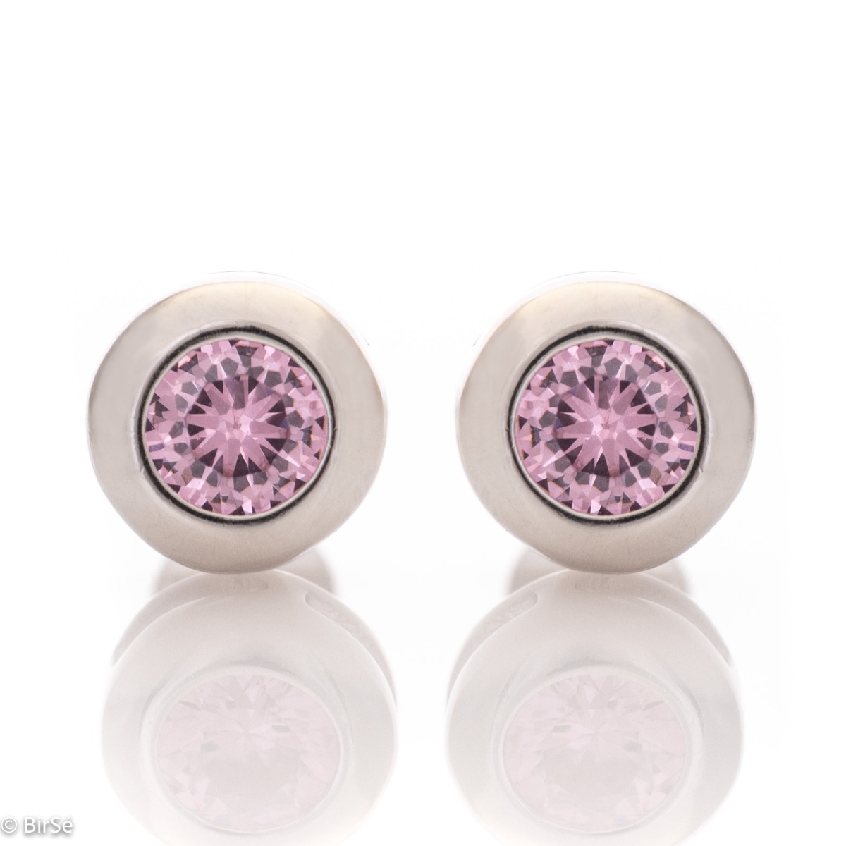 Captivating earrings, delicately crafted in fine rhodium silver with a dazzling pink stone. With their simple design, they are suitable jewelry for ladies of any age, and the pin fastening is comfortable and practical.