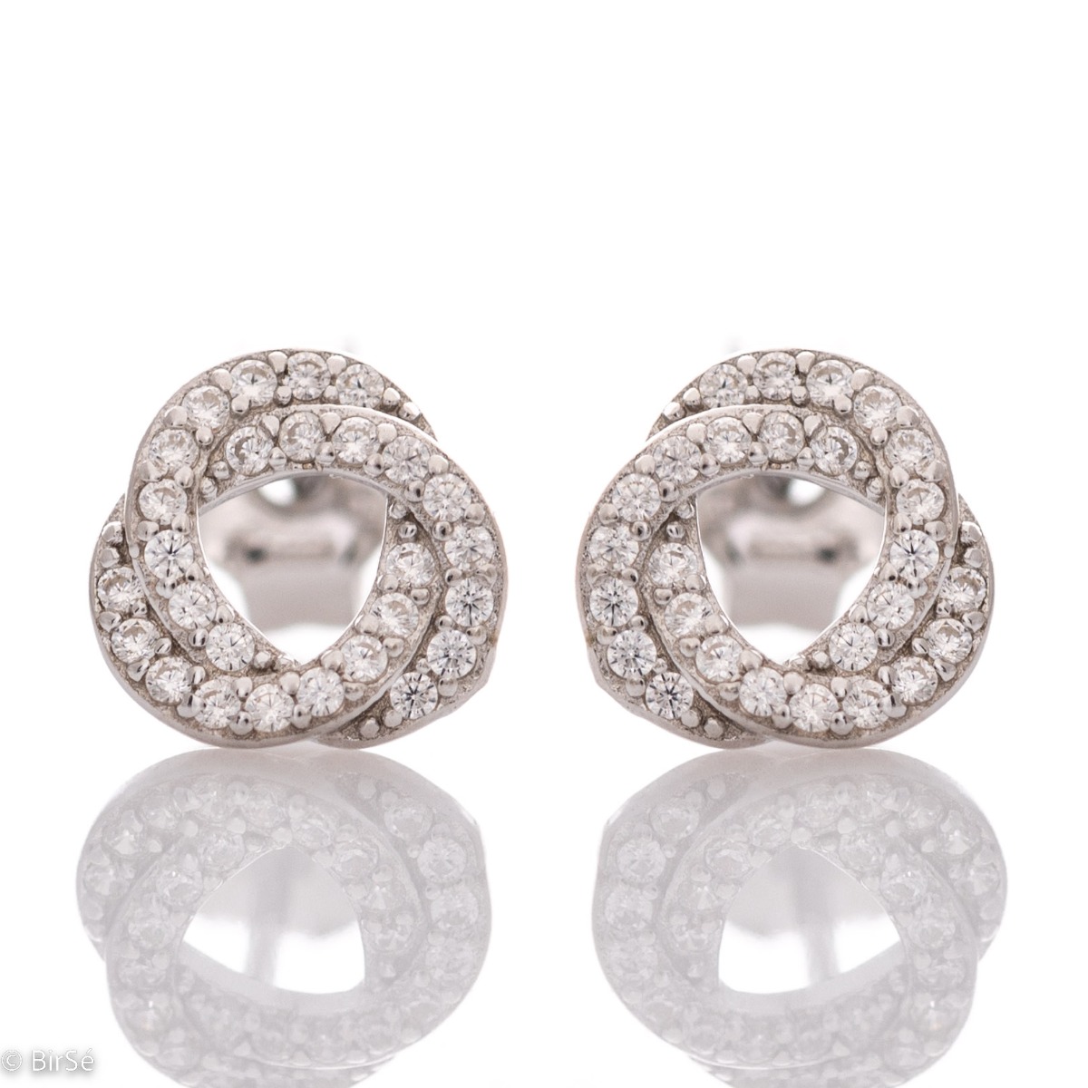 A lovely offering of earrings for your favorite jewelery collection. Elegantly crafted from fine rhodium silver in combination with sparkling delicate zircons. The earrings have a comfortable pin fastening.