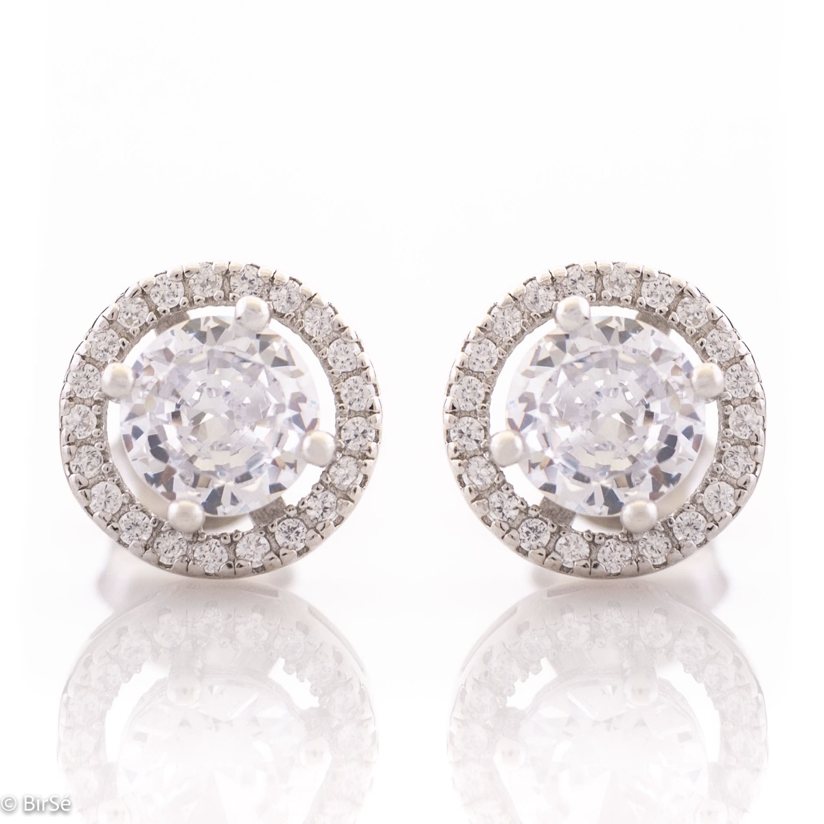 An elegant model of silver earrings, fully decorated with sparkling zircons. Fastening with a pin - convenient and practical. Suitable for your everyday life or to please your favorite child.