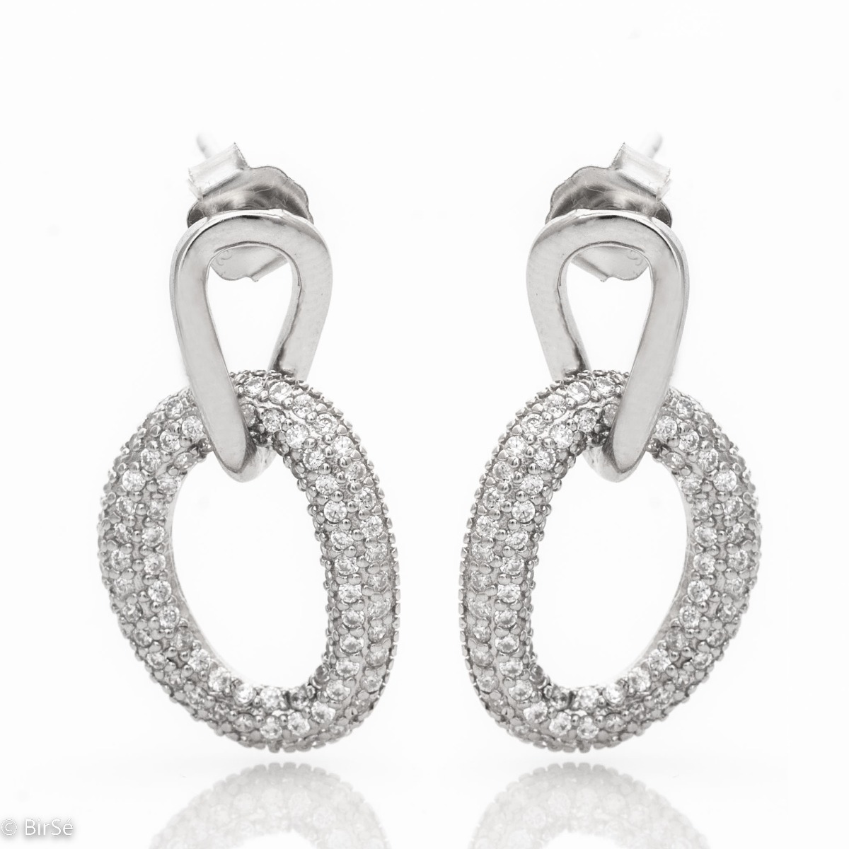 Women's earrings with an elegantly crafted model, a modern design of rhodium-plated silver and the glamorous charm of zircon stones. With a pin fastening, they are comfortable for your everyday life.