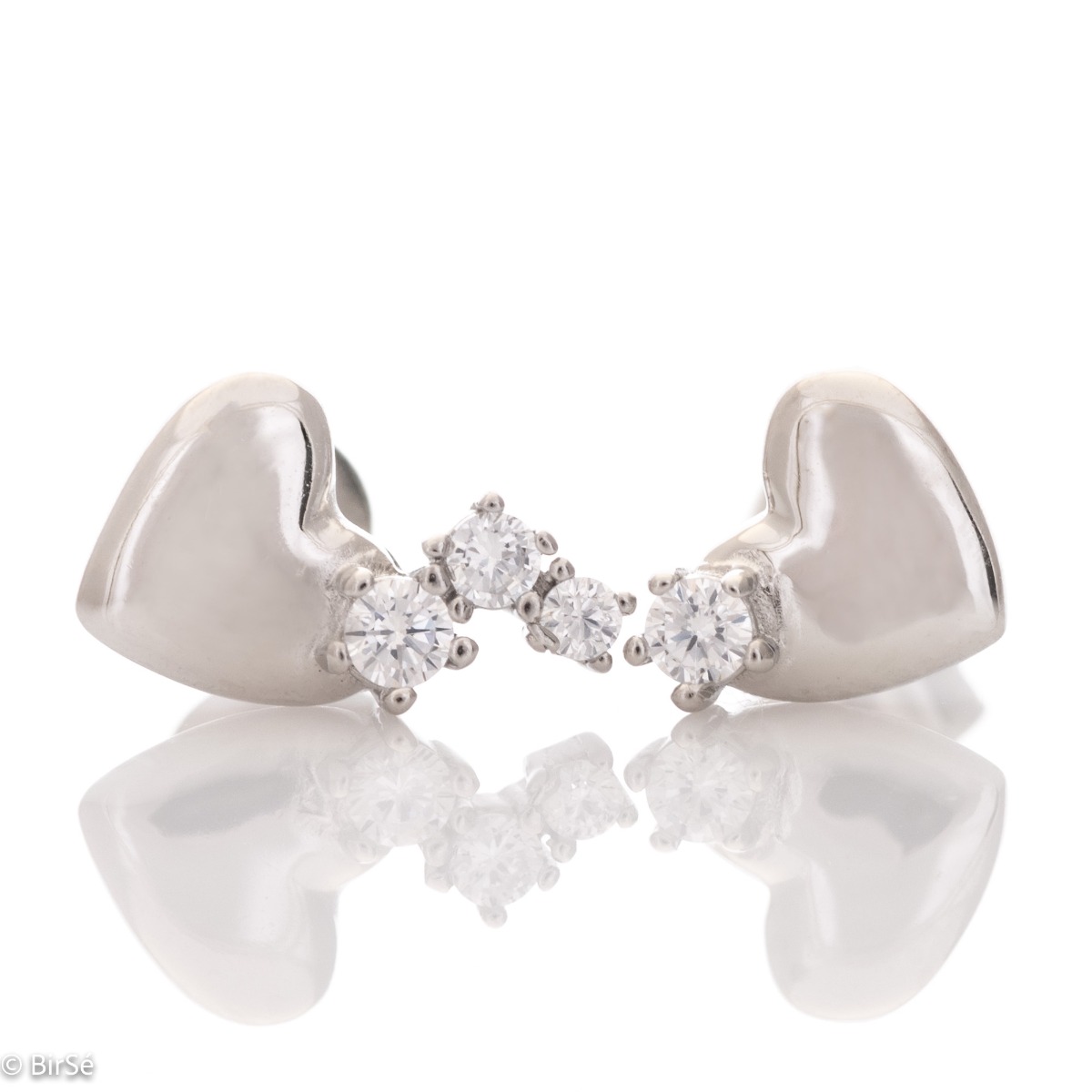 Captivatingly delicate earrings for women, entirely made of fine rhodium-plated silver in the shape of a heart. Tiny zircons are playfully attached to the main element, which add extra charm to the jewelry.