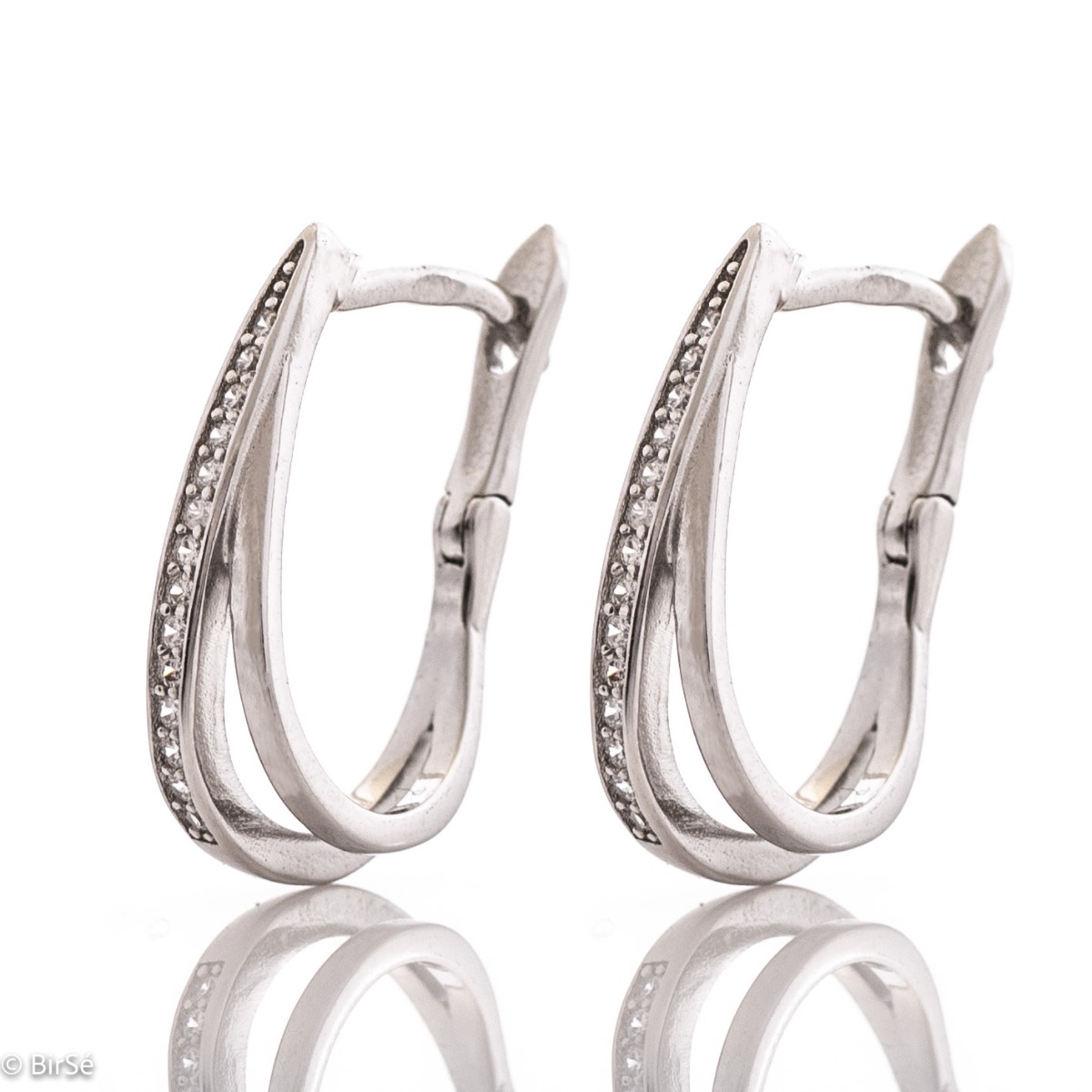 Captivating women's earrings with a spectacular shape and modern design. Made entirely of rhodium-plated fine silver with the convenient English clasp, they are a wonderful gift for your beloved woman's everyday outfit and wonderful mood. And the added zi