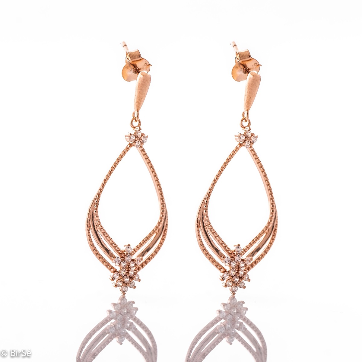 Silver earrings "Pink Magic" - an extremely beautiful piece of jewelry. Made entirely of rhodium-plated rose silver, with fine elements and added zircons for even more opulence. Pin fastening is convenient and secure for ladies.