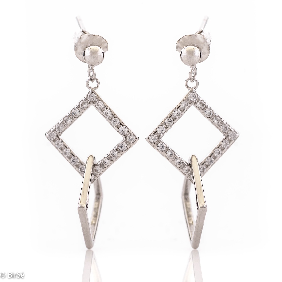 Delicately elegant silver earrings with a dangling shape and pin fastening. Stylish craftsmanship from a fine combination of rhodium-plated silver with sparkling zircons. Rhombus-shaped hanging elements and chic design are a guarantee of a great mood.