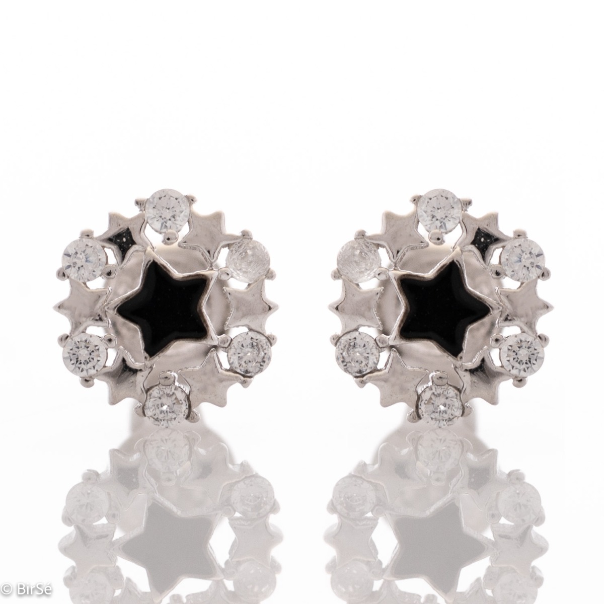 Captivatingly exquisite star earrings in rhodium-plated silver, elegantly decorated with zircons and added black enamel. Pin fastening for convenience and security. They are beautifully combined with jewelry made of silver and zircons.