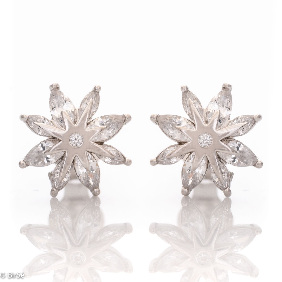 Delicate women's earrings made of fine rhodium silver, with an interesting design layout of a charming flower. Beautiful petals, exquisitely decorated with glittering zircons of different shapes, make this jewelry a suitable gift for any lady. And the pin