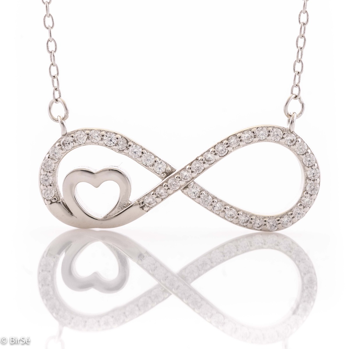 An exquisite women's necklace with precision craftsmanship entirely of rhodium-plated silver, combining a delicate infinity shape, intertwined with a heart and sparkling zircons.