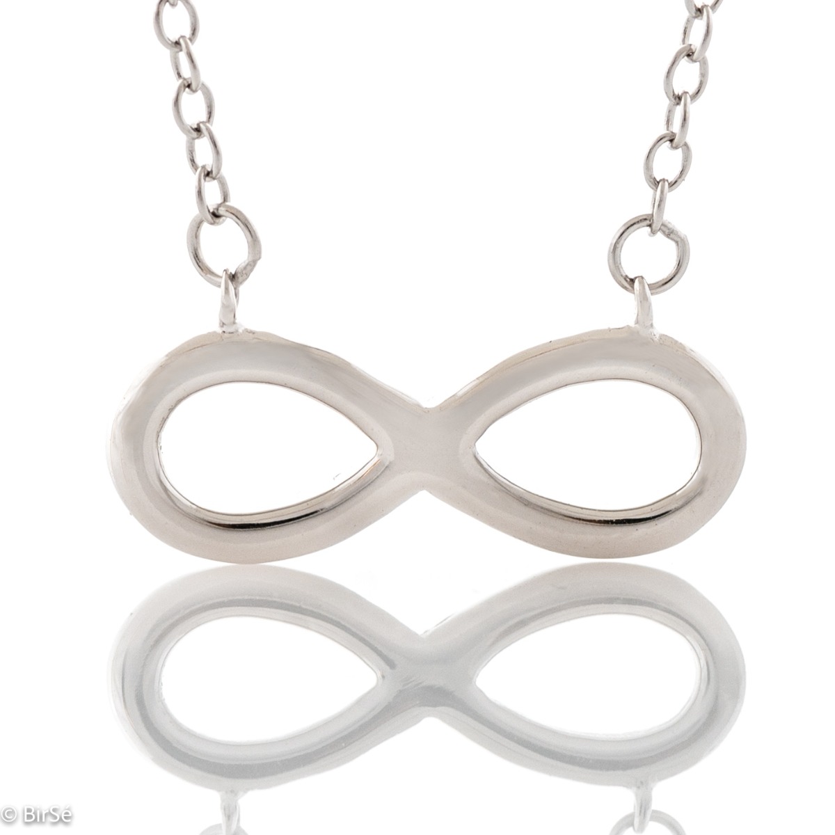 A stylish women's necklace, elegantly crafted from fine rhodium silver as a fine chain holding a simple infinity. The jewelry is suitable for every lady's everyday life.