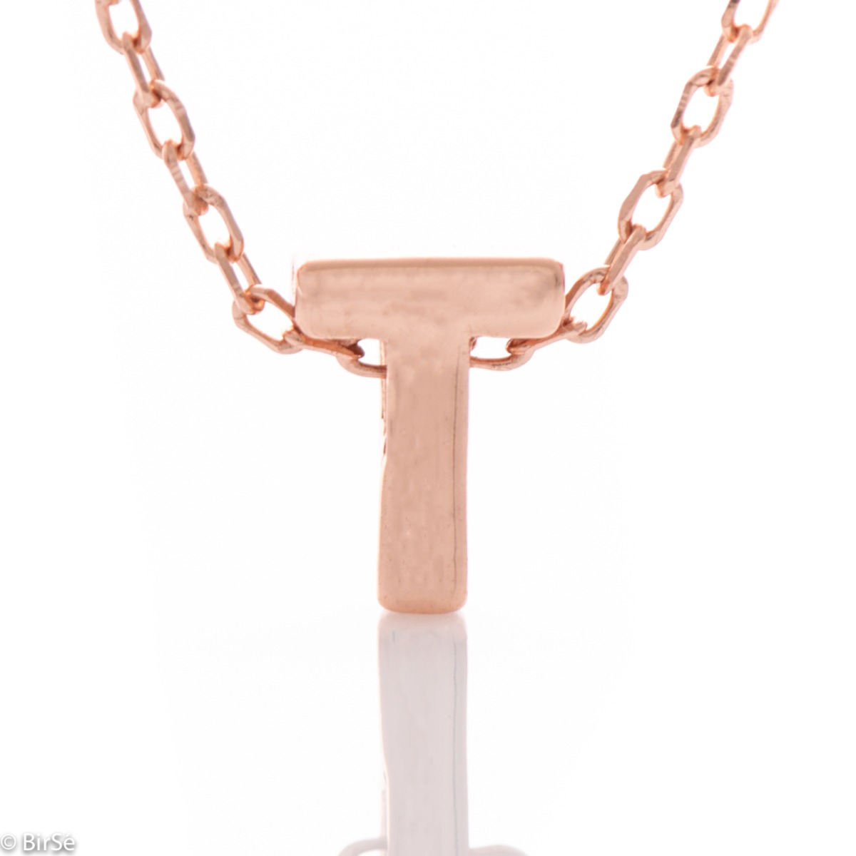 Finely crafted rose silver letter T necklace for women. An attractive piece of jewelry in which the delicate beauty of rose silver catches the eye with masterful processing. The necklace is successfully combined with earrings and rings made of beautiful r