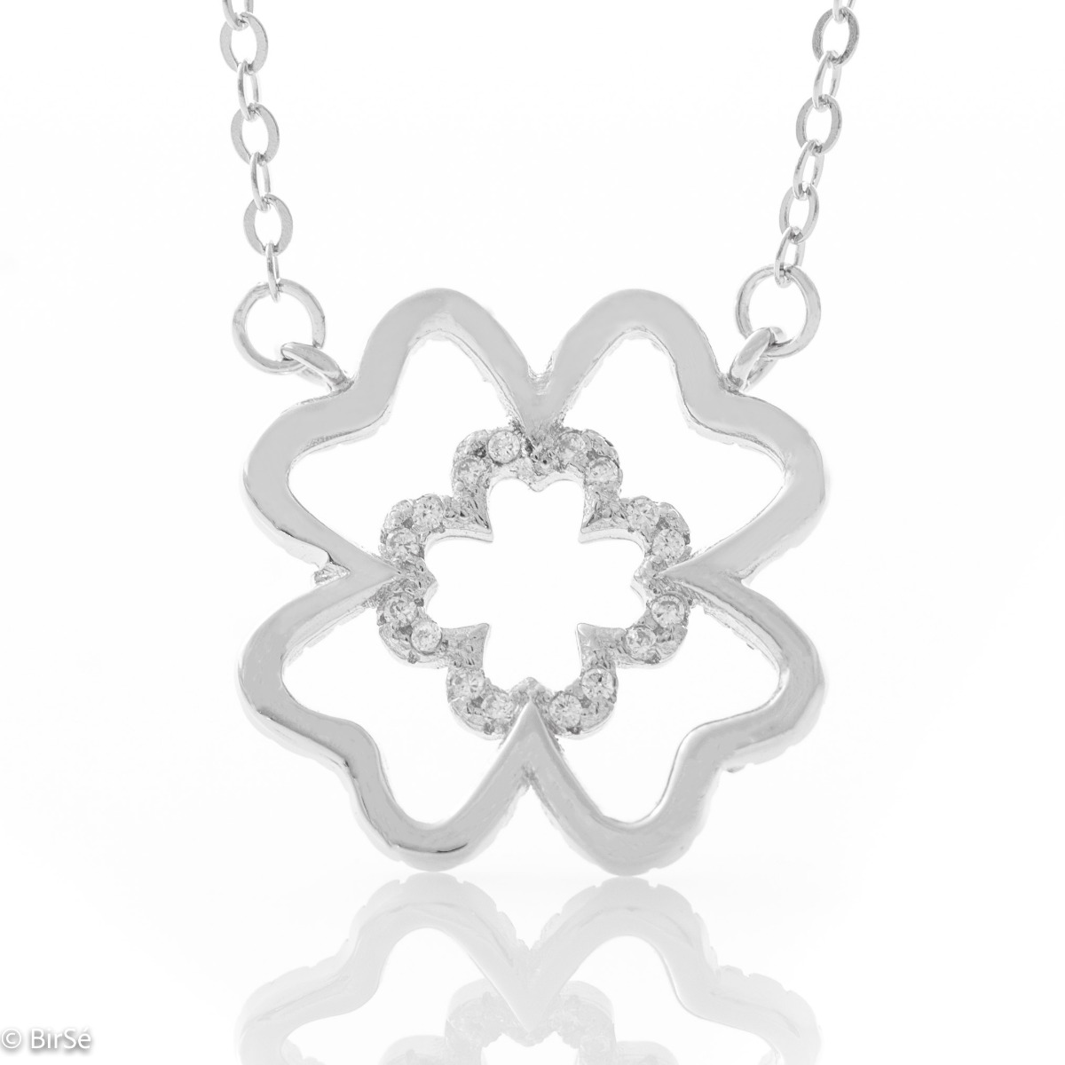 Fine silver clover necklace. Beautifully crafted in rhodium silver, it gently wraps around a fine four-leaf clover, fully embellished with cubic zirconia. The chain is delicate, with an extender to be worn according to the lady's preference.