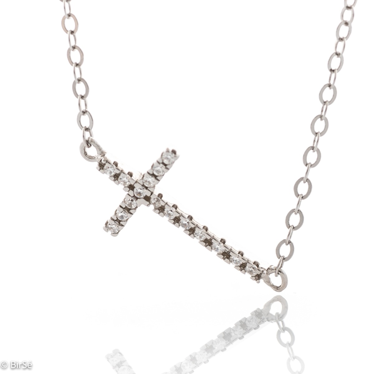 Stylish women's necklace, elegantly crafted from fine rhodium silver as a fine chain holding a beautiful cross studded with sparkling zircons. The jewelry is suitable for any lady's casual or formal outfit.