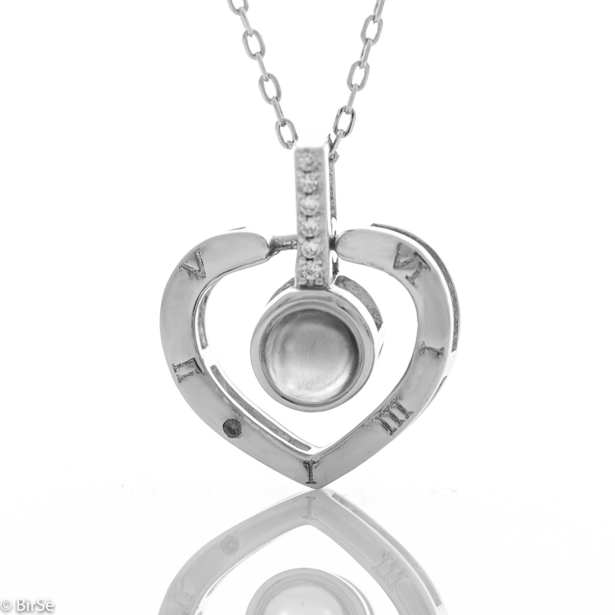 Delightful craftsmanship of rhodium silver heart shaped necklace. A unique stone adorns the center of the heart and upon its illumination, the magic of love will wash over you in 100 languages. There is no better way to say "I love you" x 100.