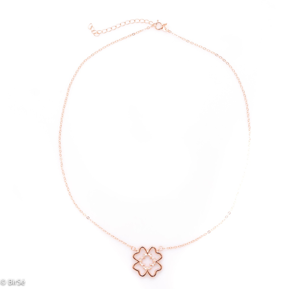 Fine silver clover necklace. Beautifully crafted in rhodium-plated rose silver, it gently wraps around a delicate four-leaf clover, fully encrusted with cubic zirconia. The chain is delicate, with an extender to be worn according to the lady's preference.